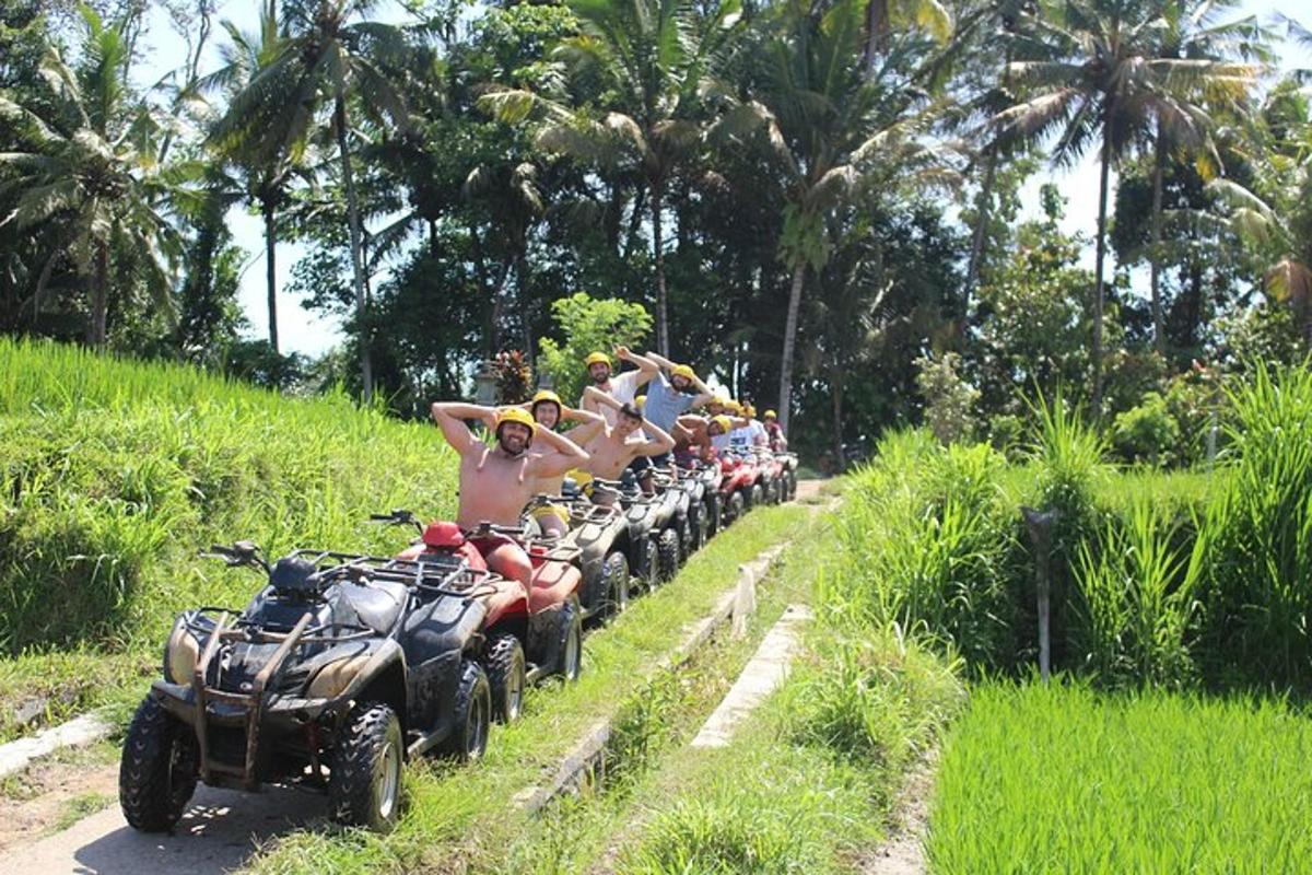 a group of people riding on atvs down a road