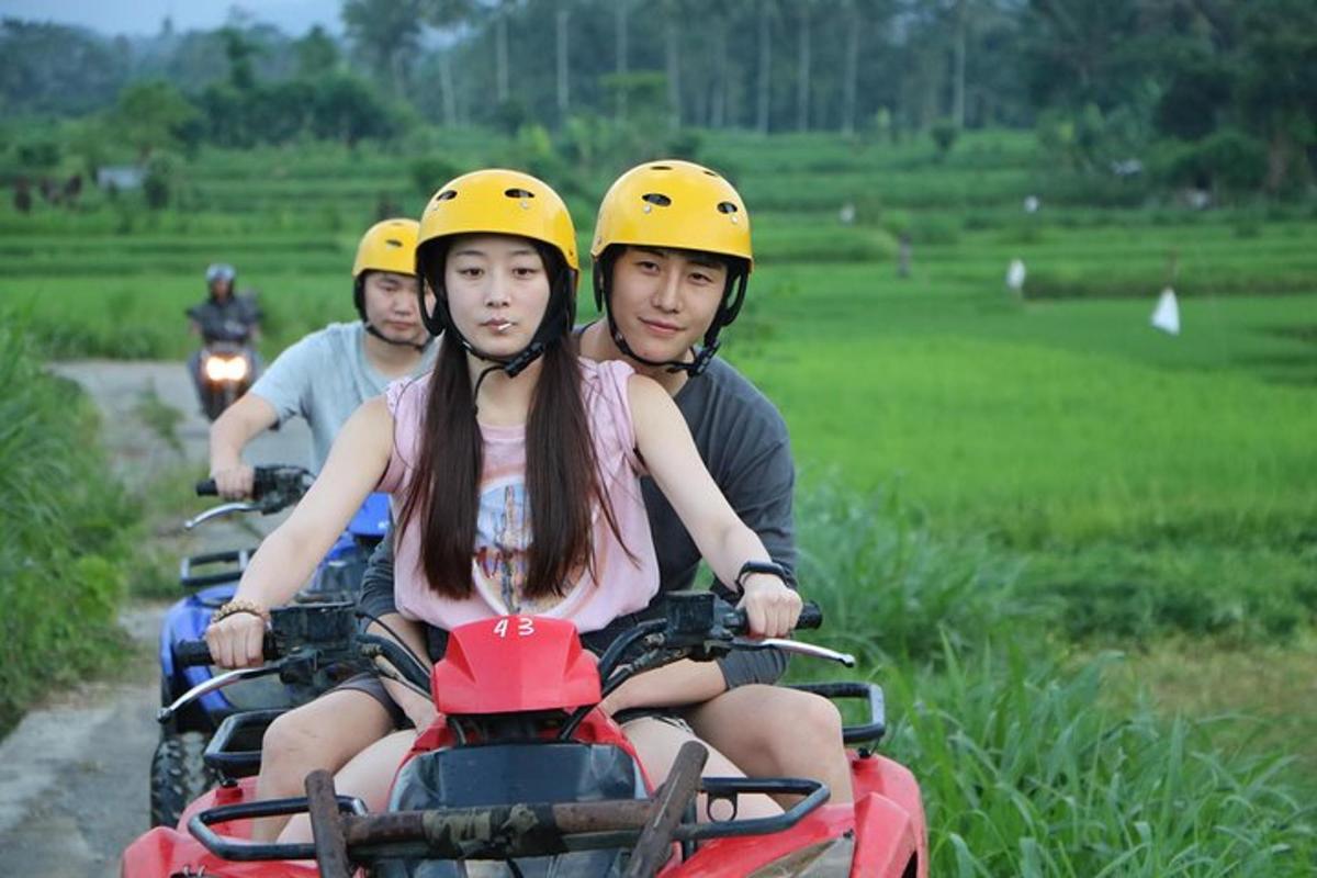 a group of people riding on motorcycles down a road