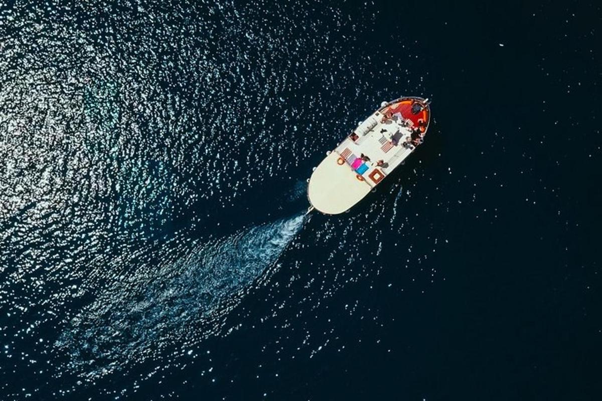 an aerial view of a boat in the water