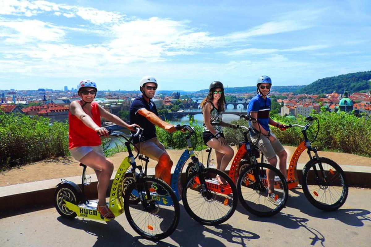 a group of people riding bikes on a hill