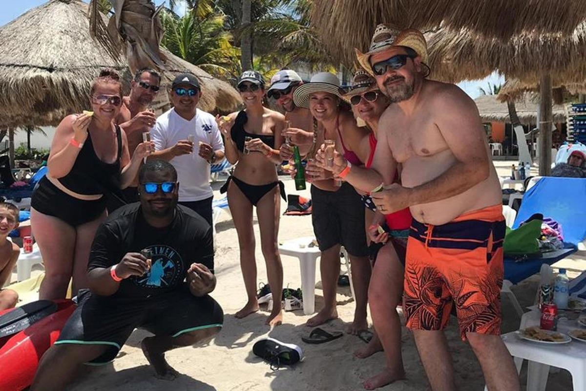 a group of people standing on the beach