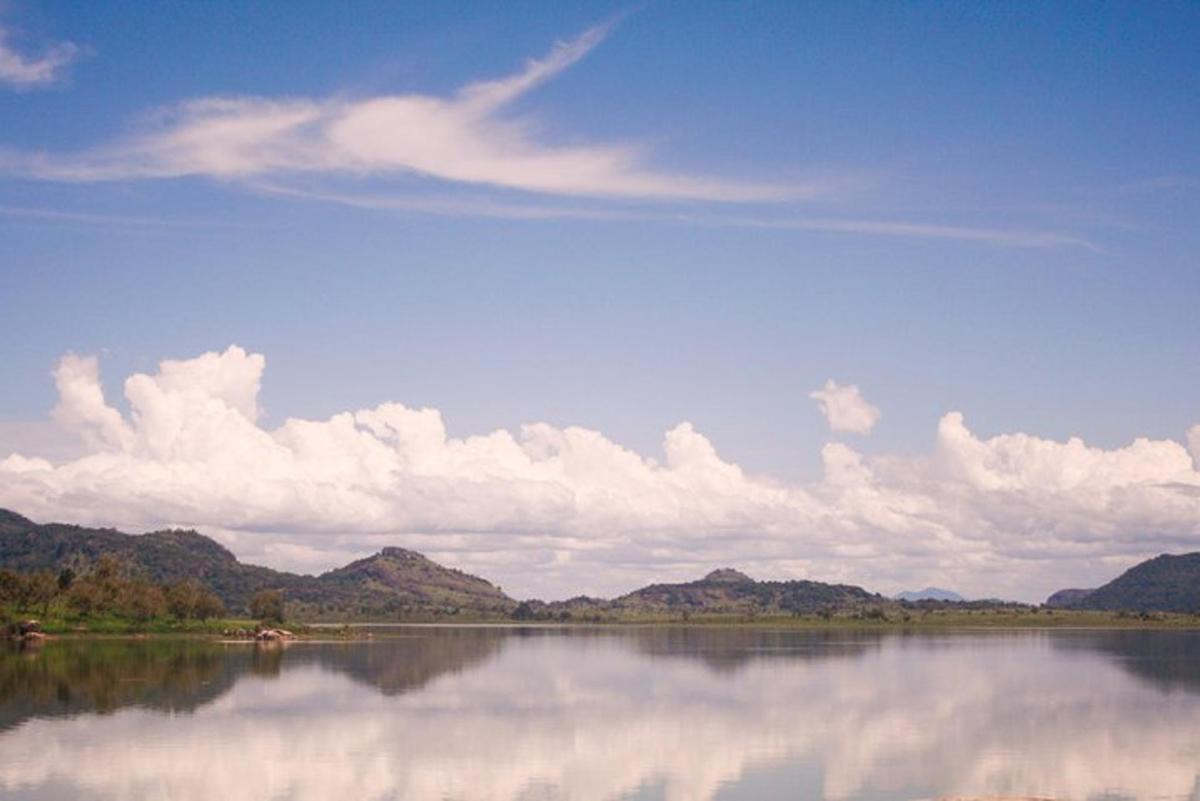 a large body of water with mountains in the background