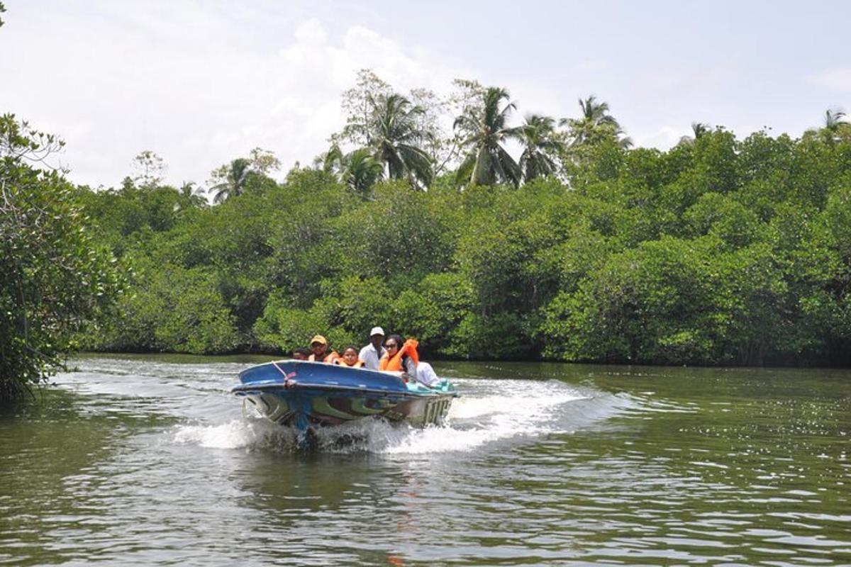 a group of people in a blue boat on a river