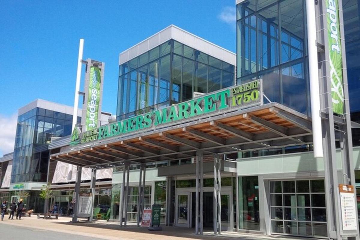 a large glass building with a sign on it