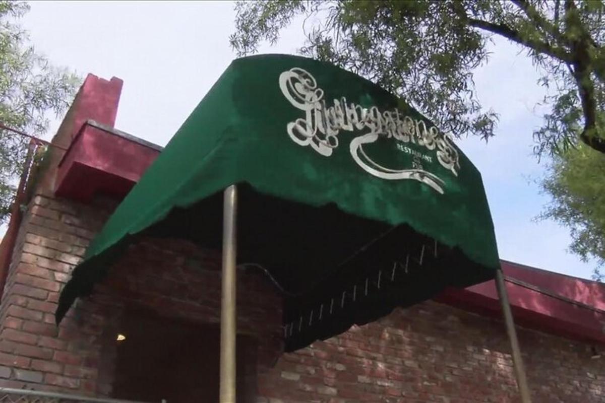 a green flag on top of a building