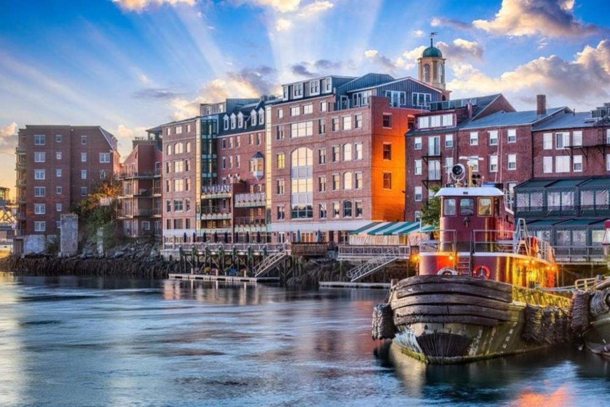 a boat is docked in a river with buildings