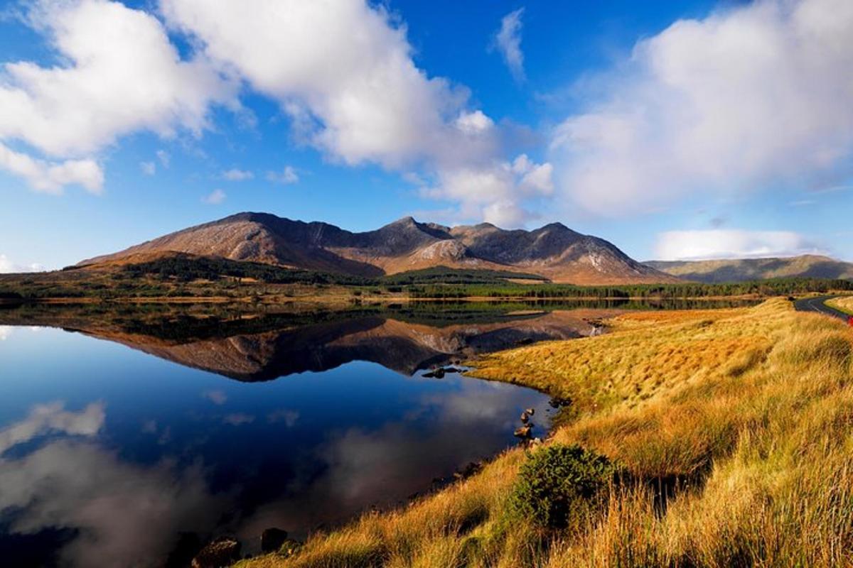 a reflection of mountains in a body of water