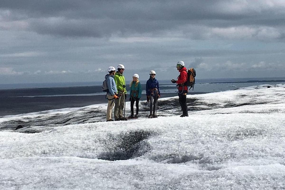 a group of people standing on top of the snow