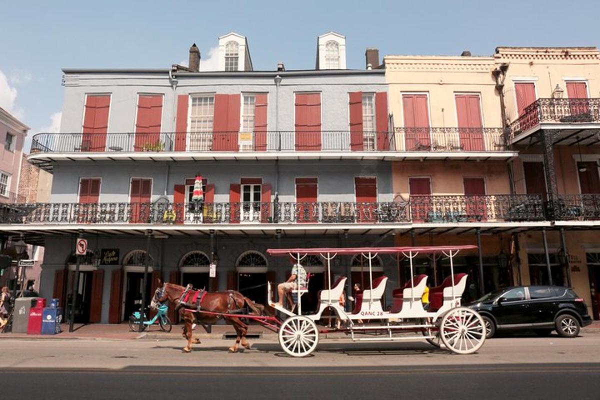 a horse drawn carriage in front of a building