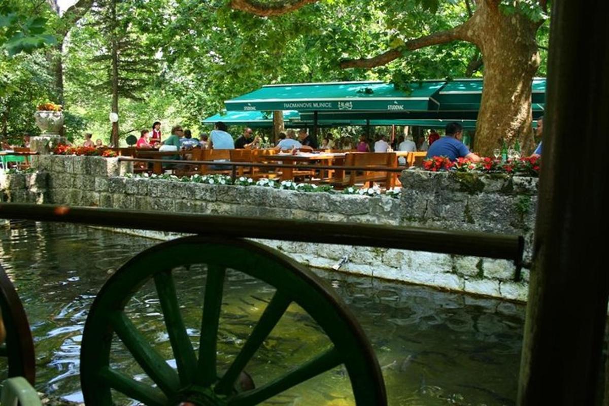 a view of a river with people sitting at tables