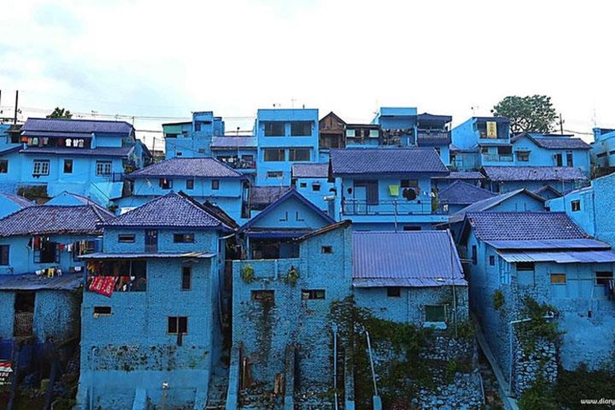 a group of blue buildings in a city