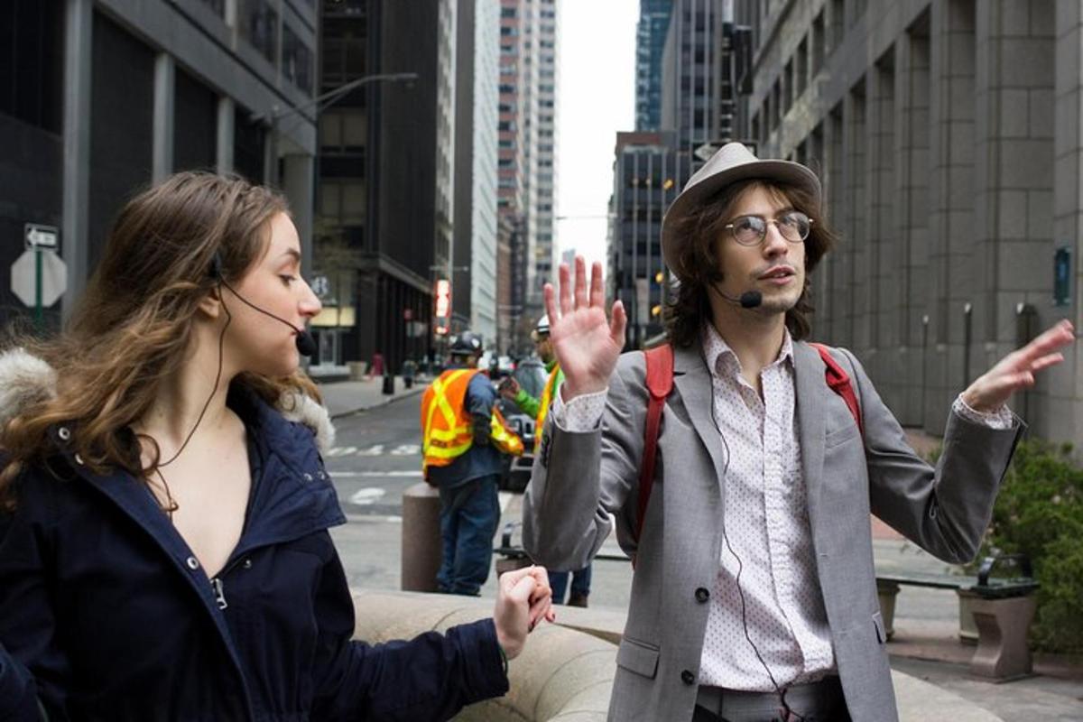 a man and a woman standing on a city street