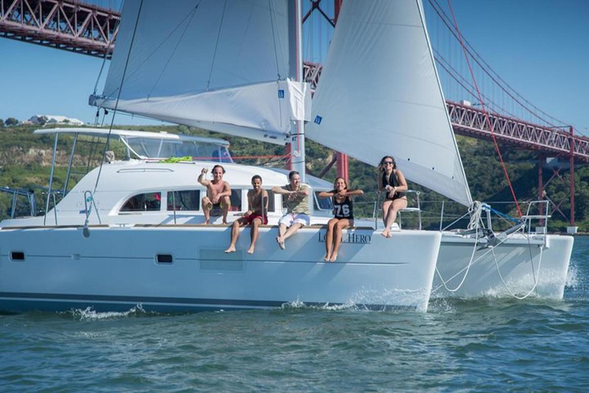 a group of people sitting on a sail boat in the water