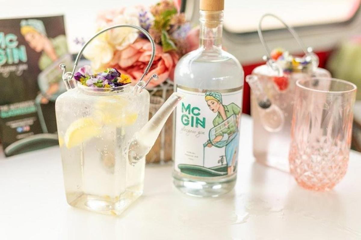 a bottle of water and a glass with a drink
