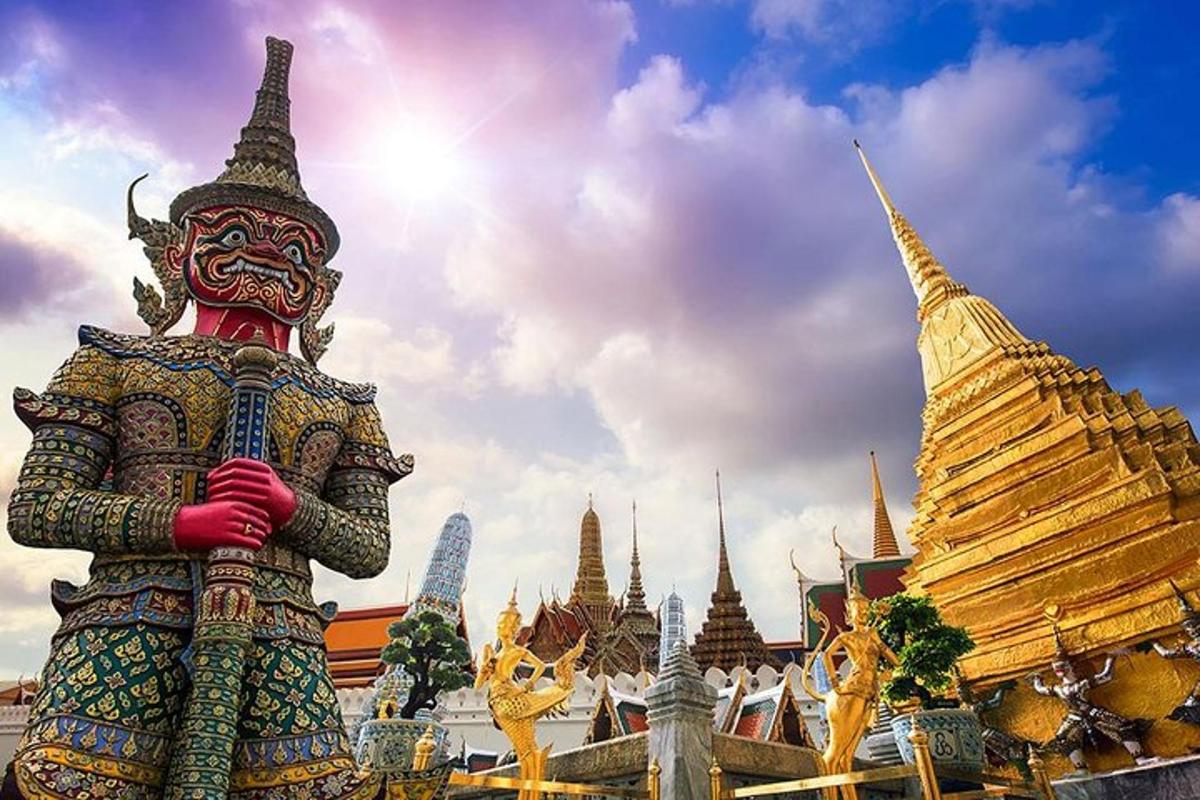 a large statue in front of a temple