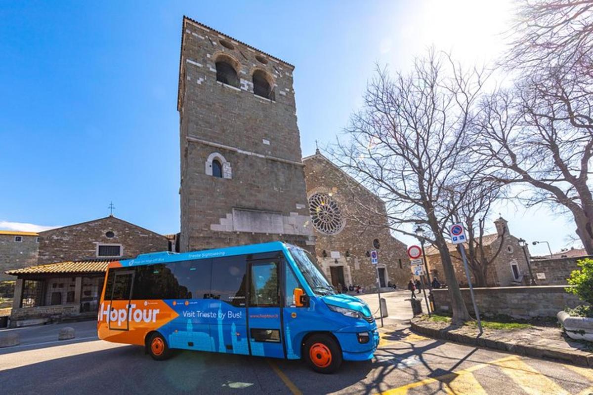 a blue bus parked in front of a church