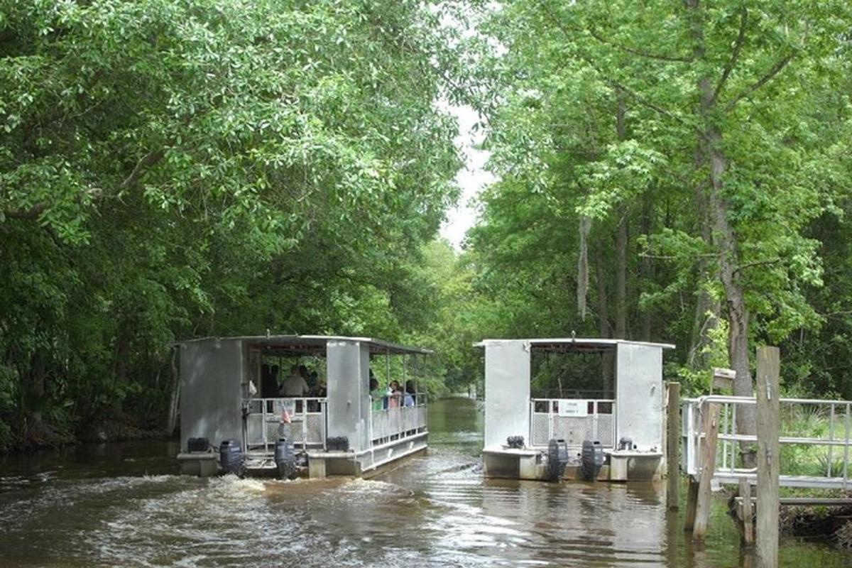 two boats in a river with people on them
