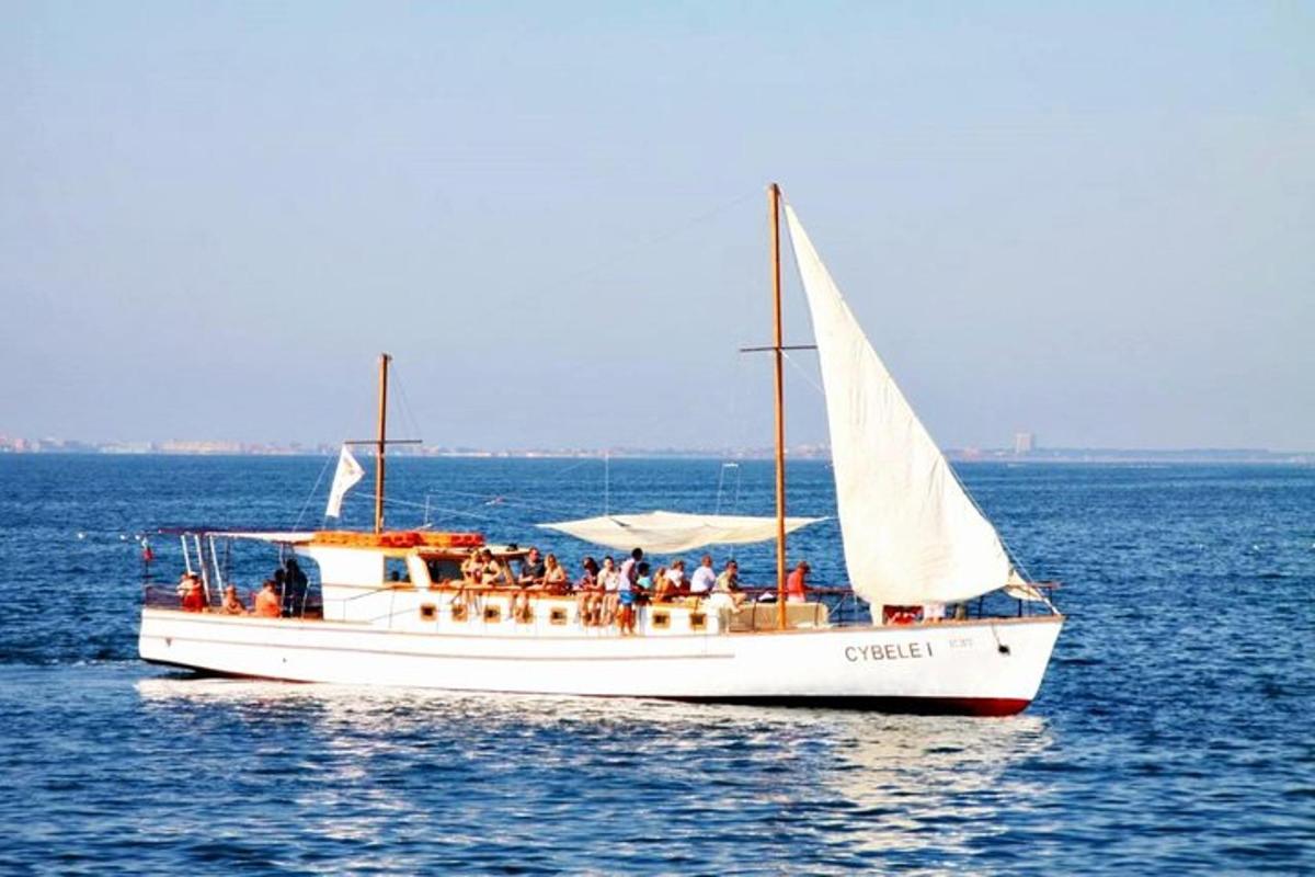 a group of people on a boat in the water