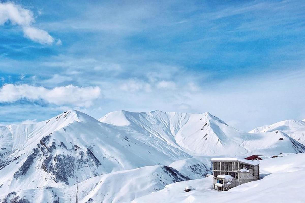 a building on top of a snow covered mountain