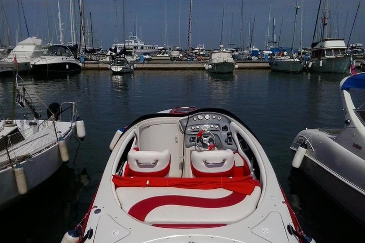 a boat is docked in a harbor with other boats