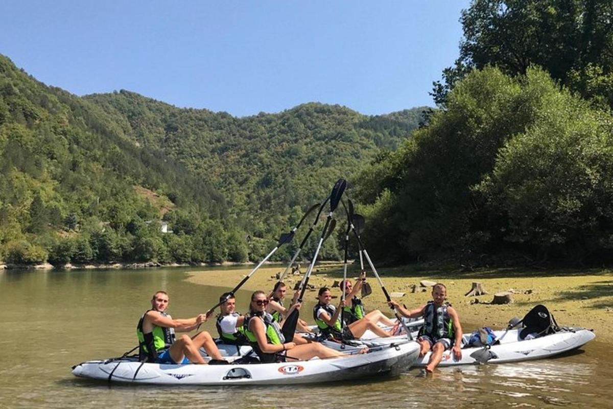 a group of women sitting on a raft on a river