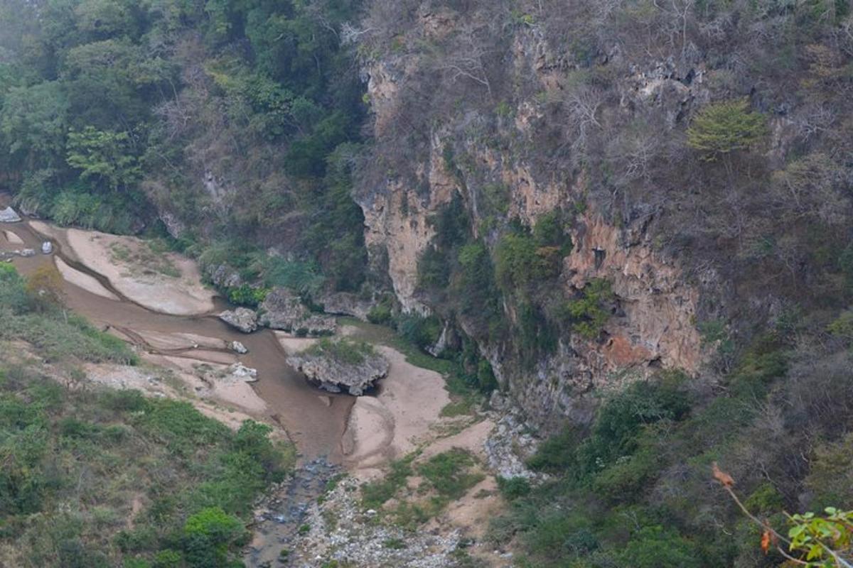 an aerial view of a river in a mountain