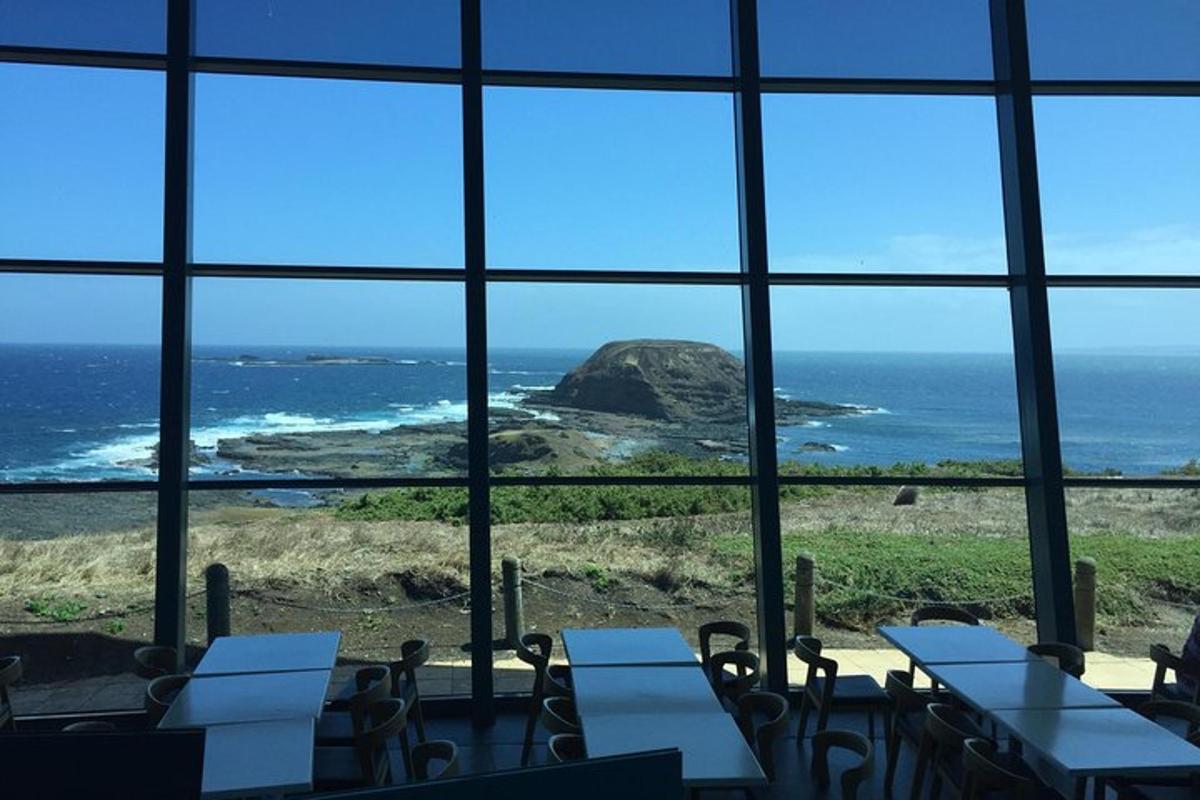 a room with a view of the ocean through a window