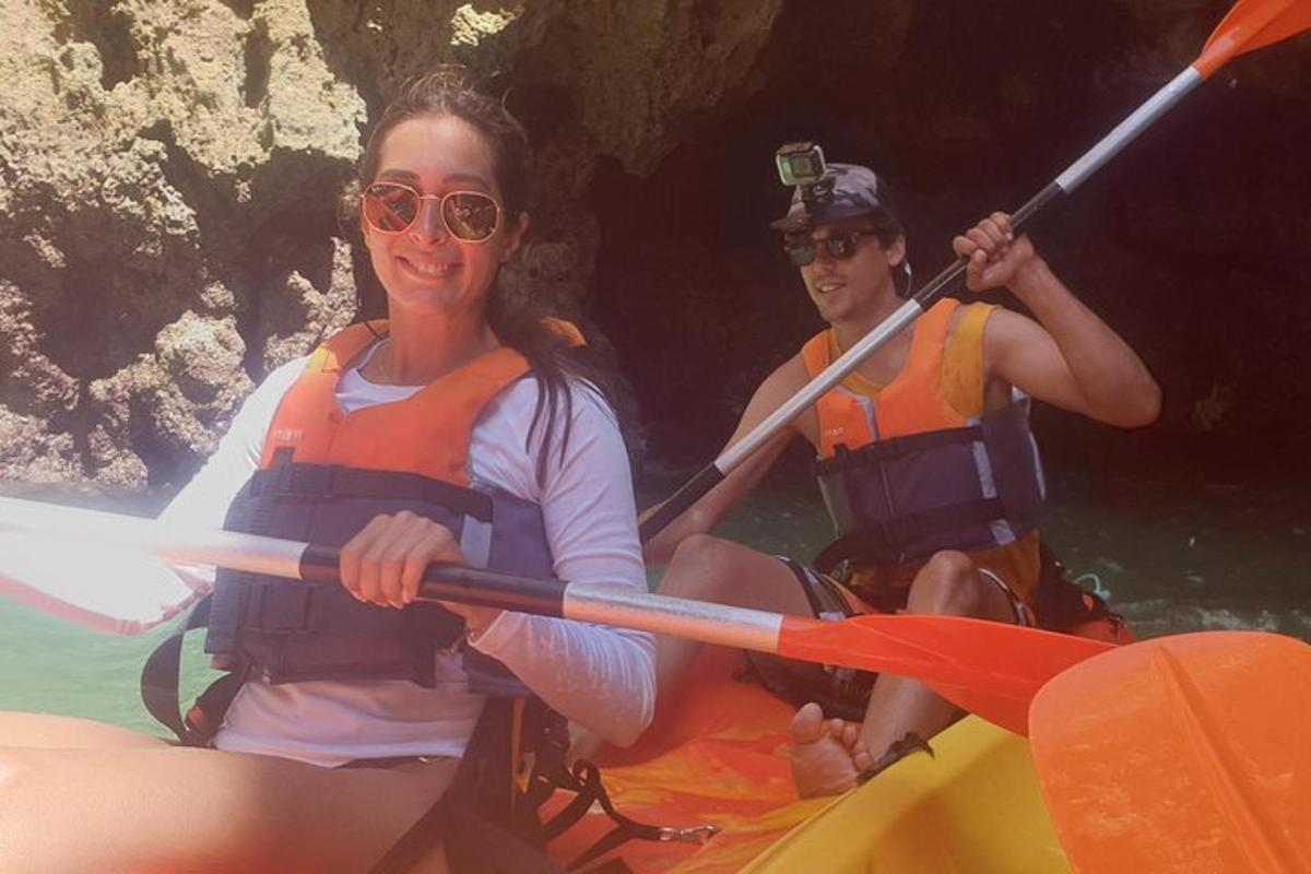 two people in a kayak in the water