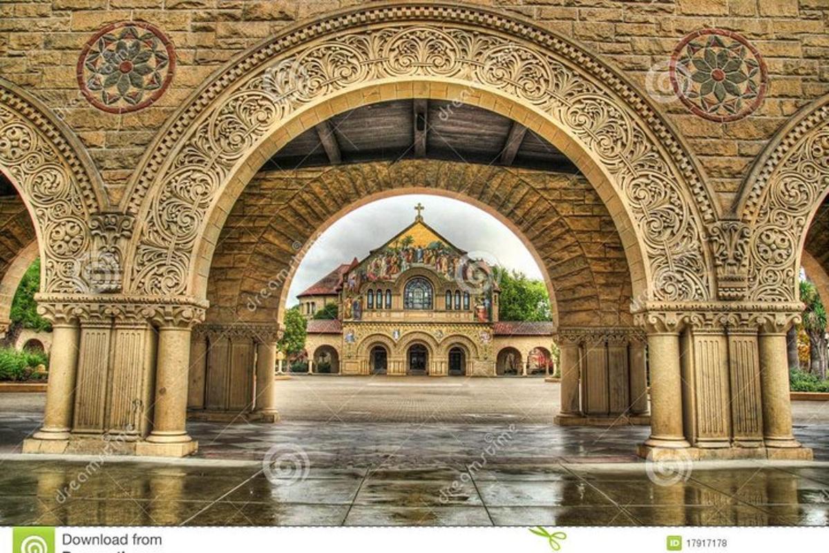 an archway view of a building in a courtyard