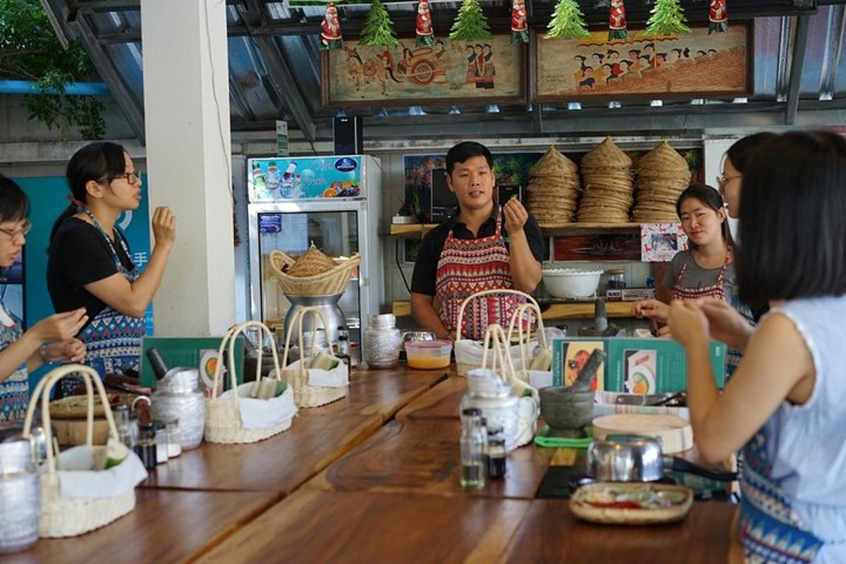 a group of people standing around a table with baskets