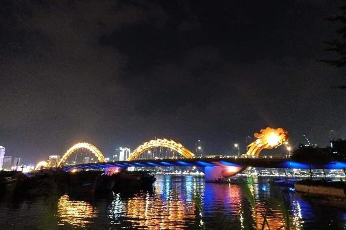 a bridge over the water at night with
