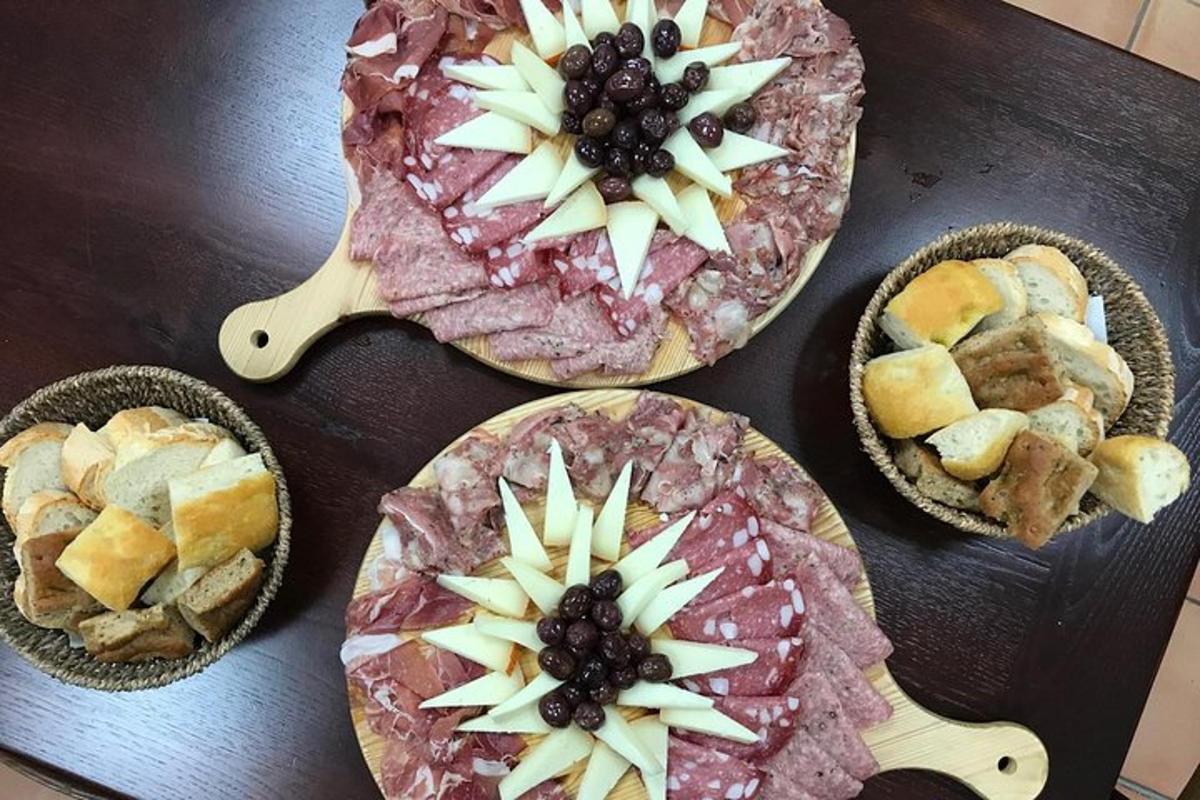 a table topped with four pizzas with fruit on them
