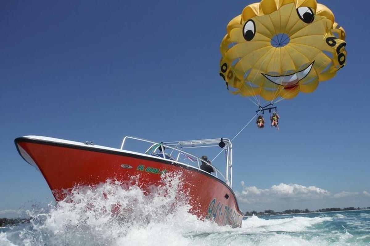 a boat in the water with a yellow balloon