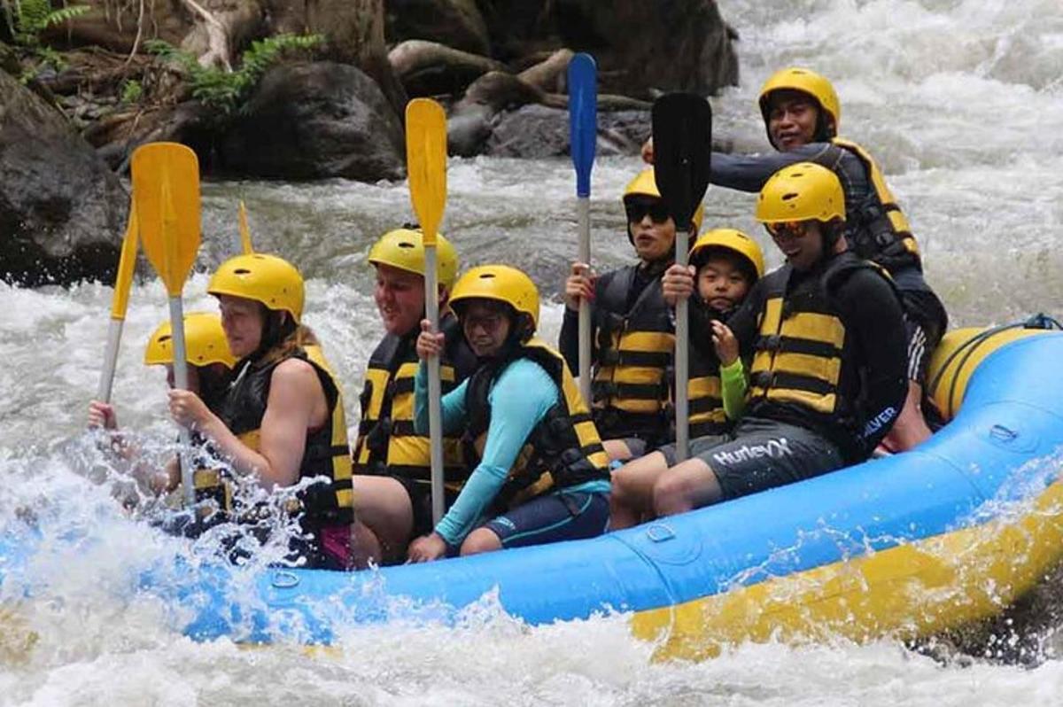 a group of people in a raft on a river