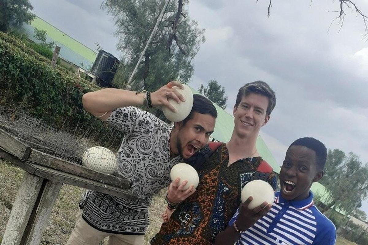 a group of three men holding balls in their hands