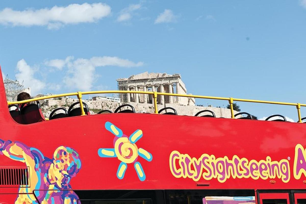a red double decker bus with a sign on it