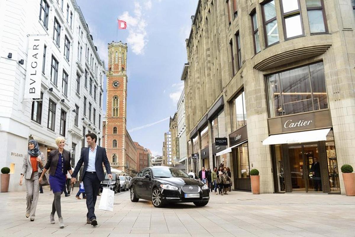a group of people walking down a city street