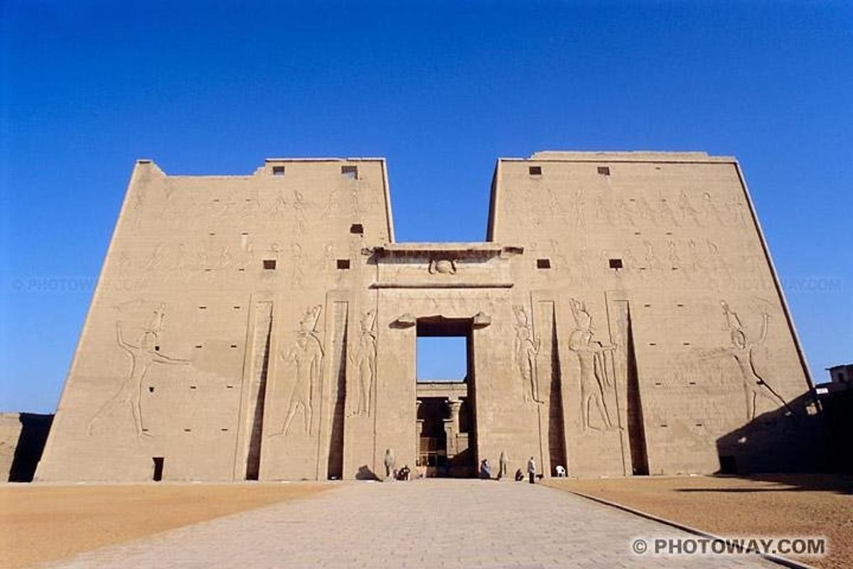 a large building with reliefs on the side of it