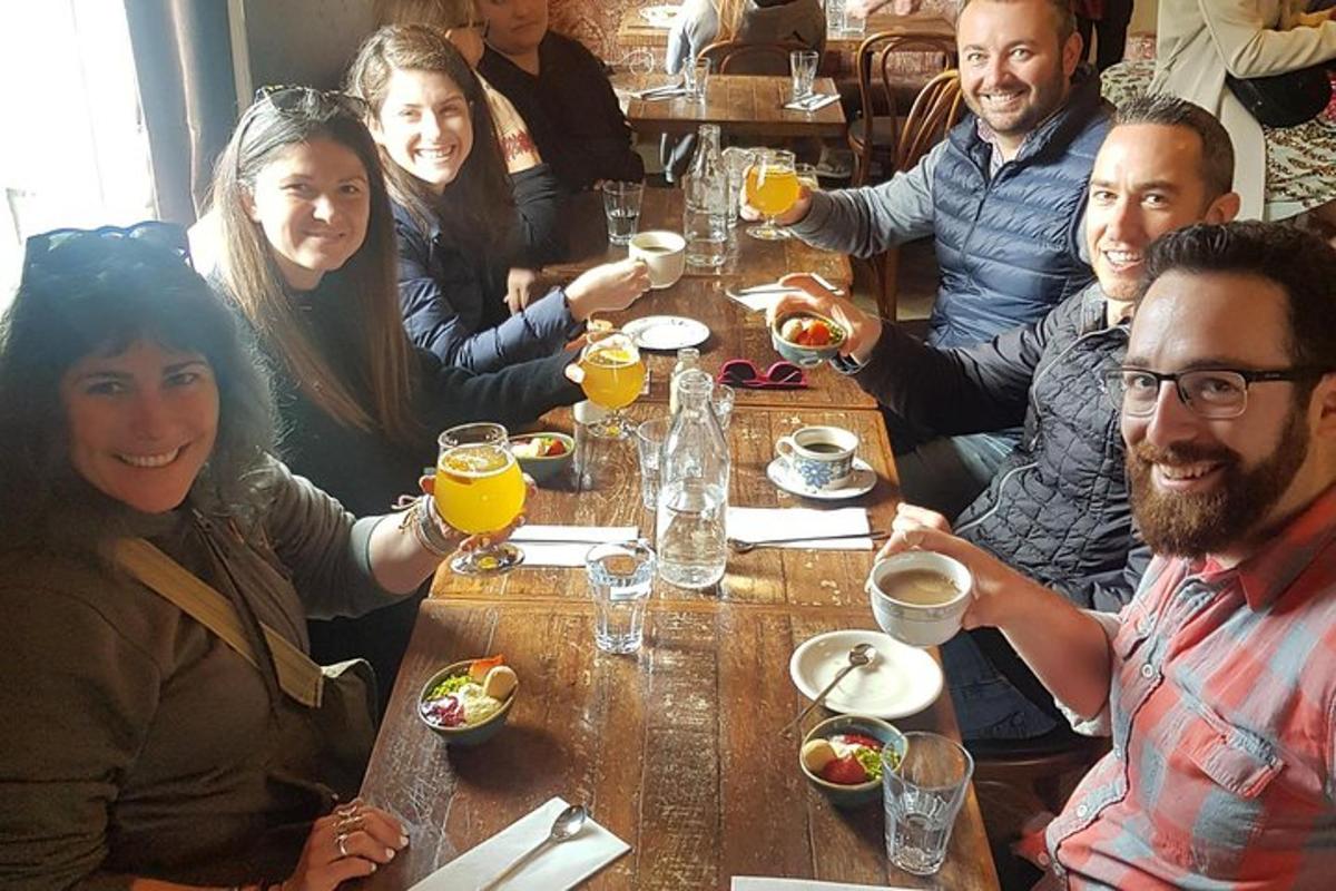a group of people sitting at a table with drinks