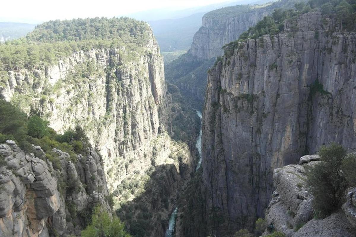a view of a canyon with a river in it
