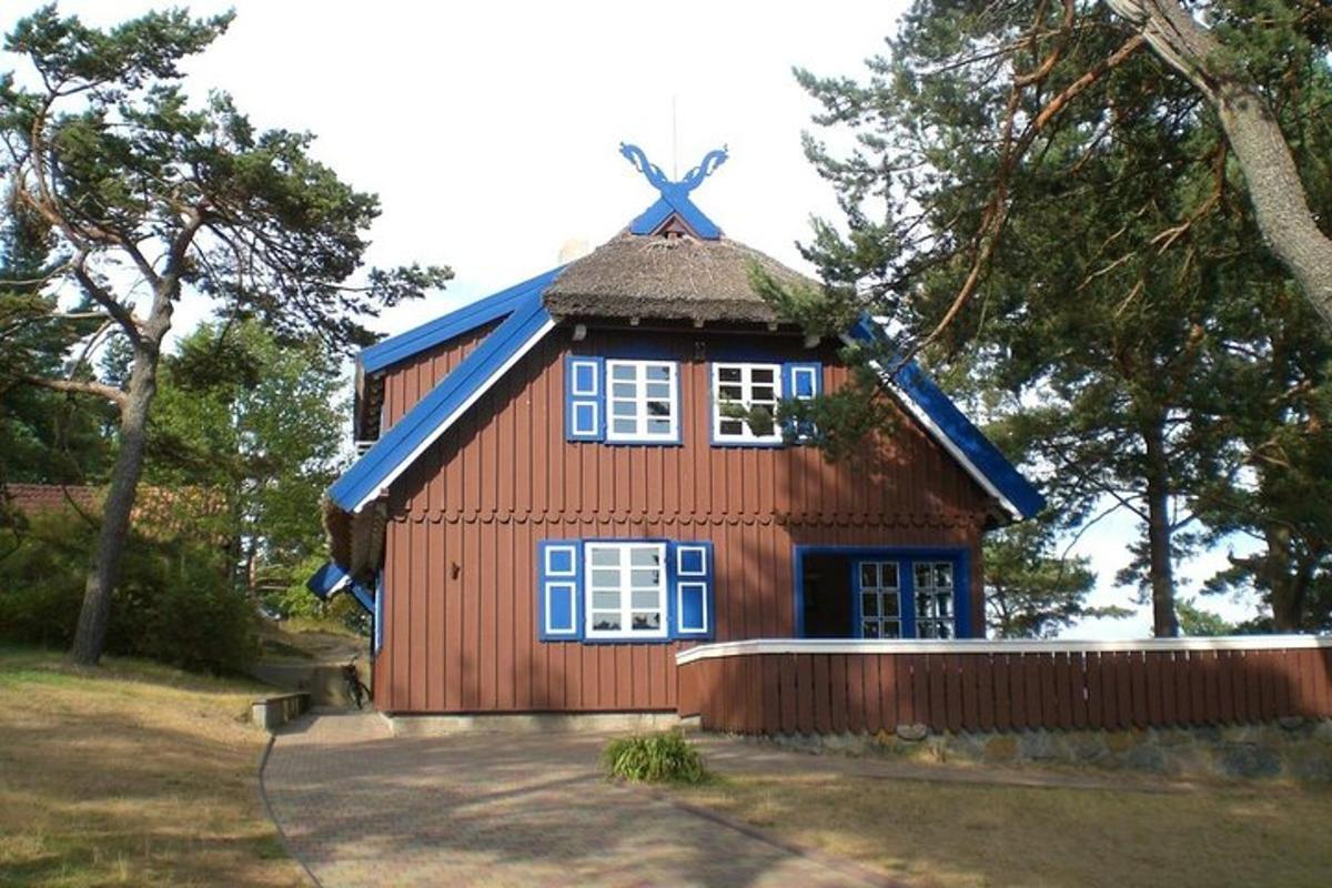 a small red house with a blue roof