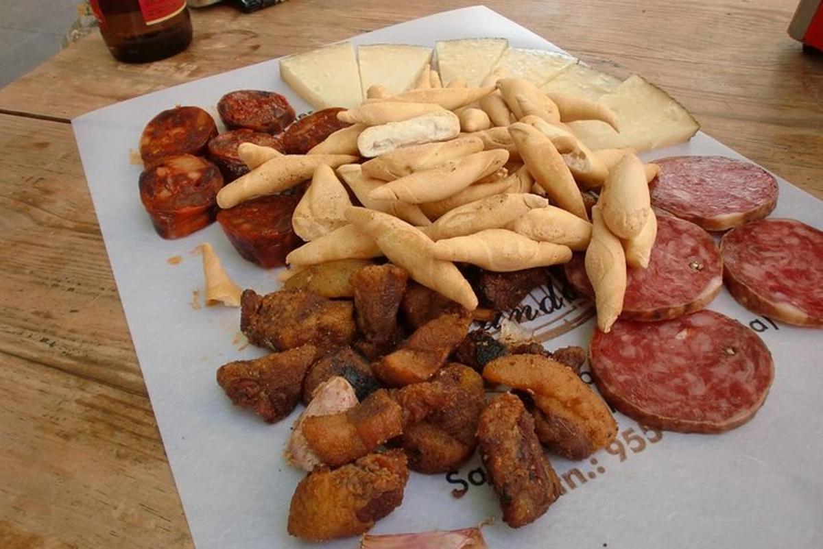 a plate of food with meat and french fries