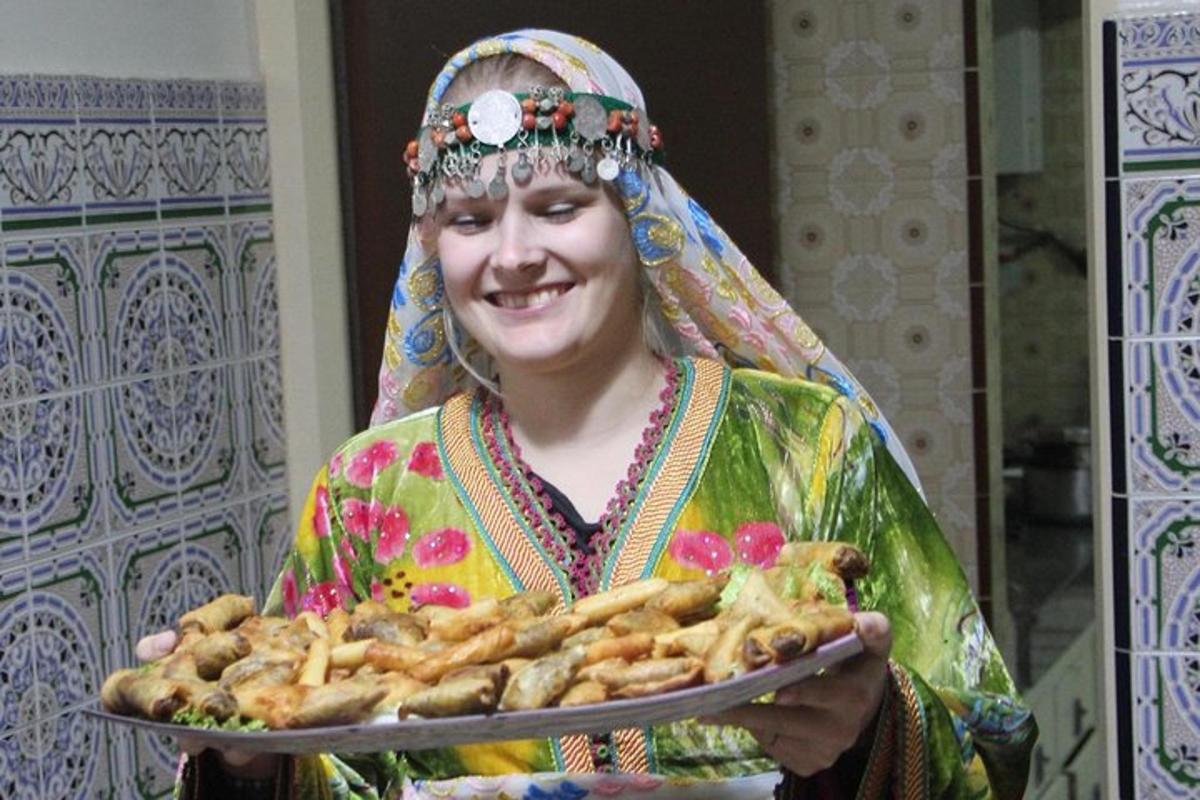 a woman is holding a plate of food