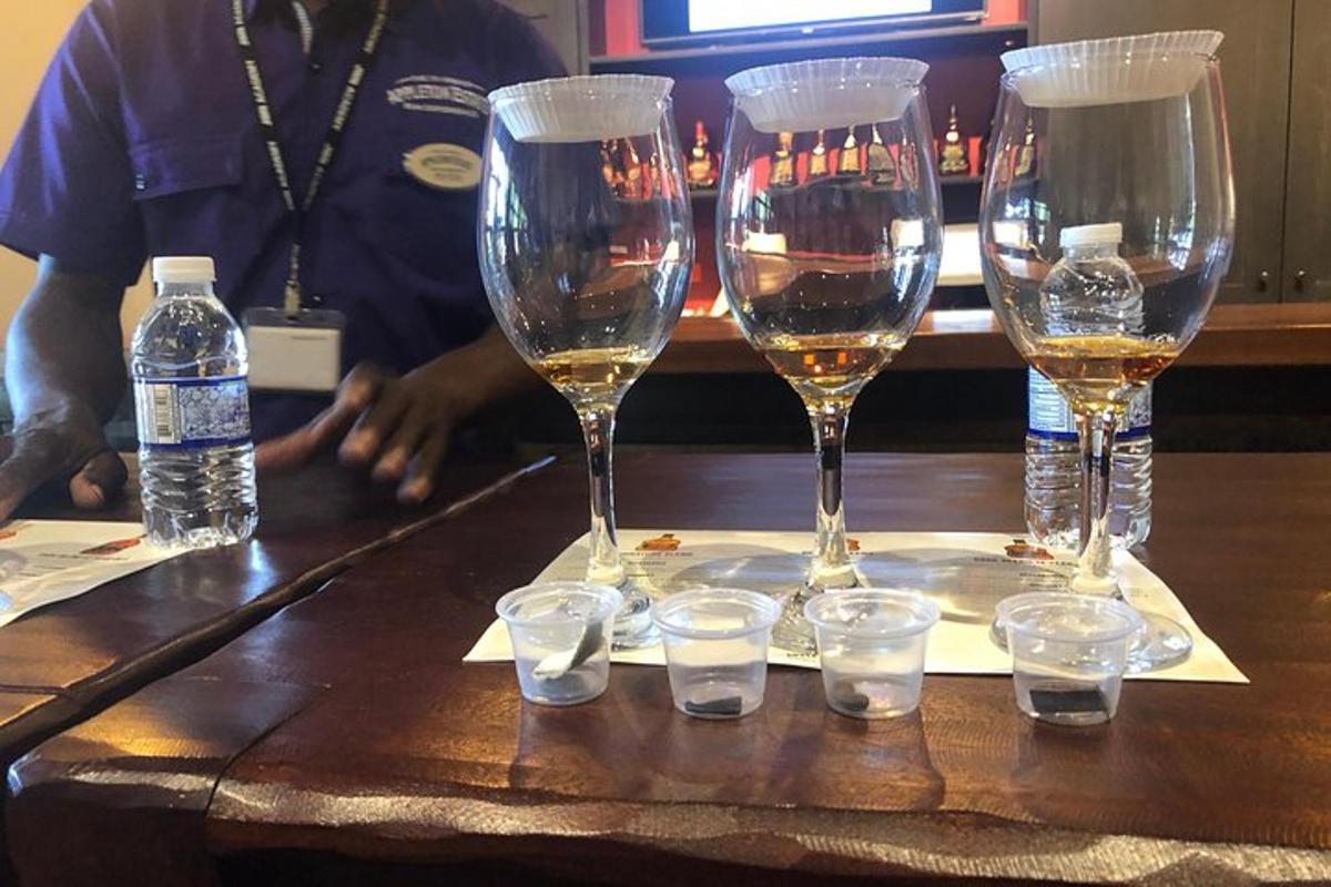 a group of wine glasses on a table with water