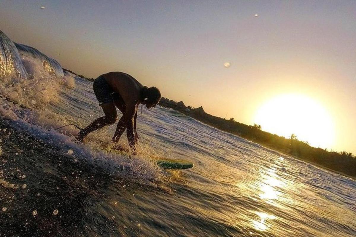 a man riding a wave on a surfboard in the ocean