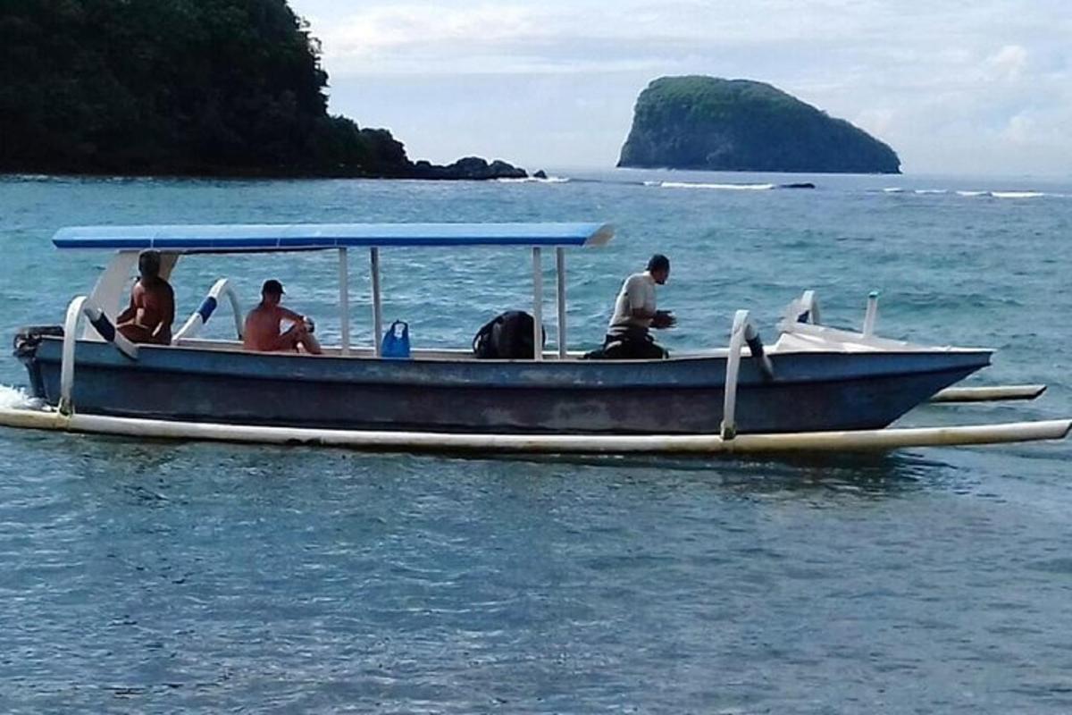 a group of people sitting on a boat in the water