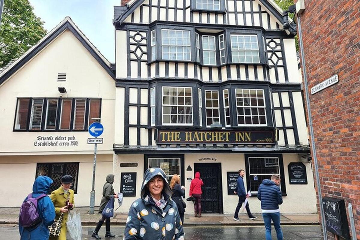 a woman standing in front of a black and white building