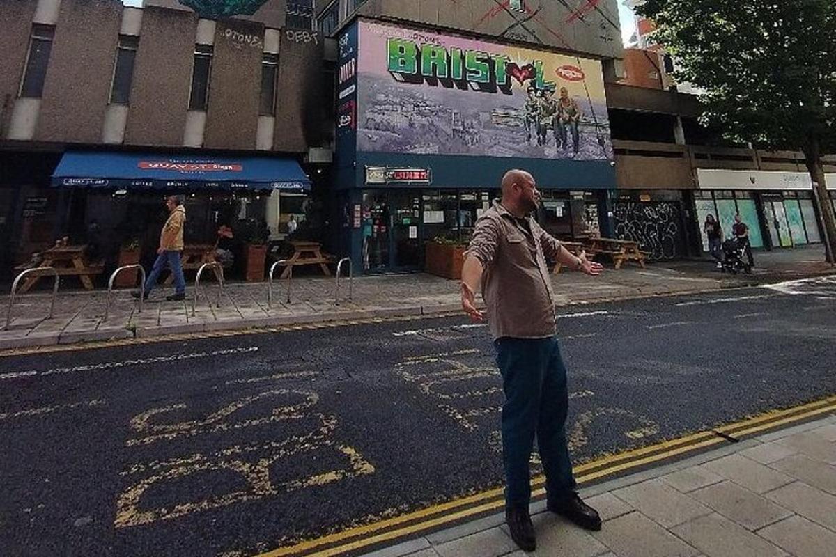 a man standing on the side of a street