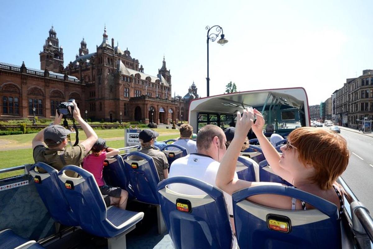 a group of people taking pictures of a bus