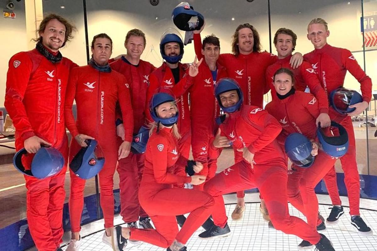 a group of people in red suits posing for a picture